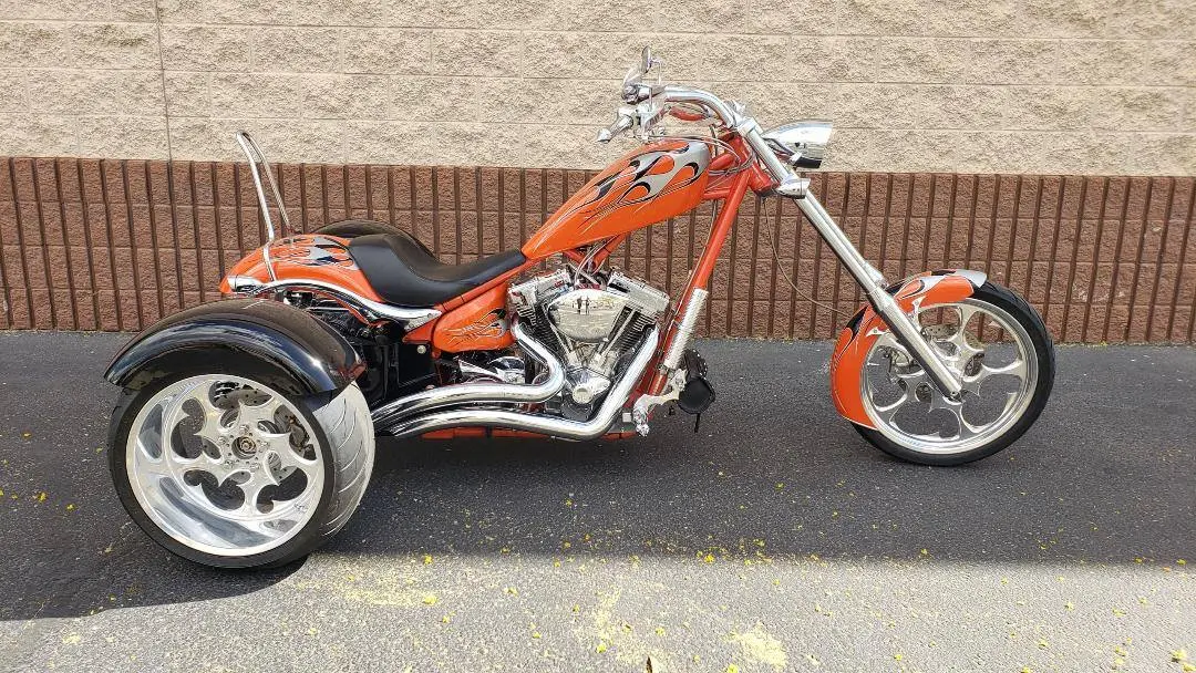 A motorcycle is parked on the side of the road.