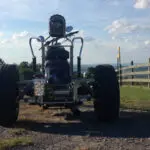 A large tire is on the back of an atv.