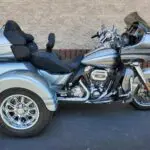 A motorcycle with a side car parked on the street.