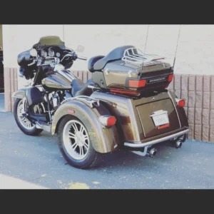 A motorcycle with a side car parked on the street.