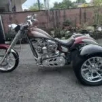 A motorcycle with a side car parked in the street.